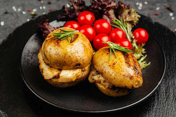 juicy golden grilled barbecue meat with spices on dark background