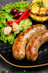 juicy golden grilled barbecue meat with spices on dark background