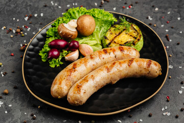 juicy golden grilled barbecue meat with spices on dark background