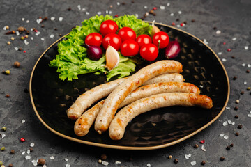 juicy golden grilled barbecue meat with spices on dark background