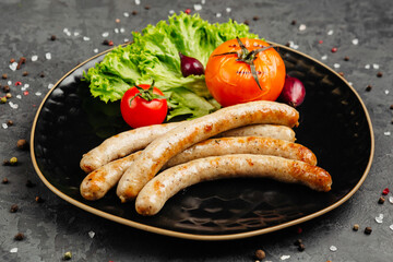 juicy golden grilled barbecue meat with spices on dark background