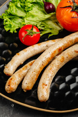 juicy golden grilled barbecue meat with spices on dark background