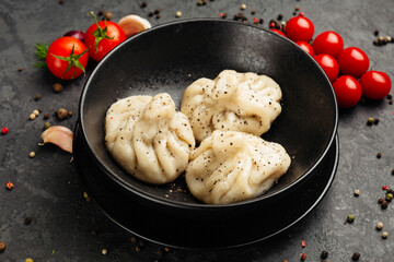 juicy golden grilled barbecue meat with spices on dark background