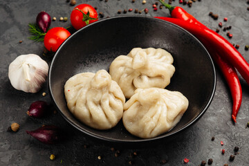 juicy golden grilled barbecue meat with spices on dark background