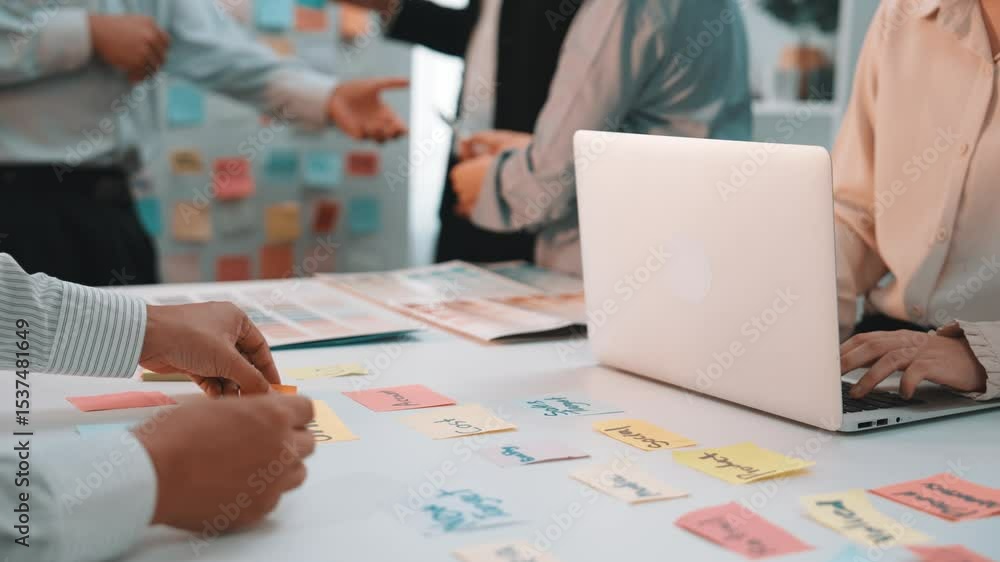 Aufkleber a dynamic scene of professionals collaborating in a modern office, using sticky notes and a laptop d