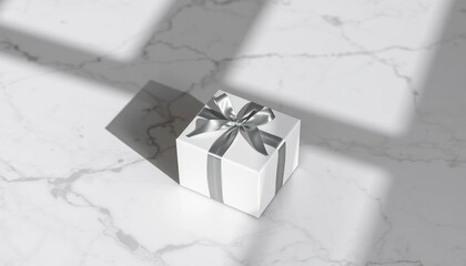 Minimalist presentation of a pristine white gift box with silvery ribbon on marble