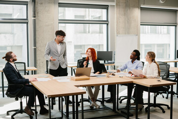 Business team discussing new project during meeting in modern office
