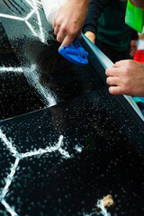 Detailer uses spray-assisted method to apply vibrant blue vinyl wrap for perfect, bubble-free...
