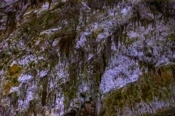 Exploring beautiful Postojna cave in Slovenia the most visited european cave.  Thousands of stalagmites and stalactites