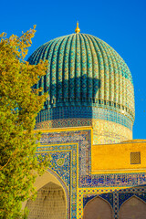 Gate of Amir Temur Gur e Amir Mosque in Samarkand, Uzbekistan.  Translation: in the name of Allah Almighty who creates