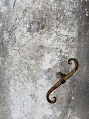 Rusty Hook on Aged Wall Texture