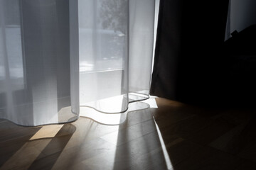 Sunlight going through tulle in the hotel room
