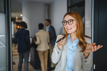 Confident smile adult businesswoman record voice mail on mobile phone