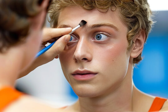 Enthusiastic sports fan applying makeup for the game in a  close up reflection