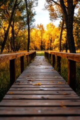 Fototapeta premium Serenity of the Wooden Bridge Leading Into an Autumn Forest Landscape.