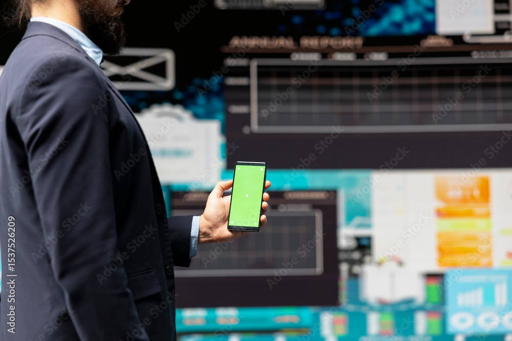 Poster professional man looks at green screen and explores strategy planning with insight and financial dat