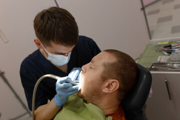 Fototapeta premium Dentist Examining Patient's Teeth