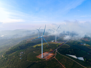 Aerial drone view of Wind generators in Da lat Vietnam, sustainable energy in lush landscapes