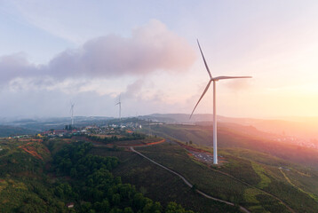 Wind turbine at sunset, sustainable energy in scenic landscape. Ecology electricity technology, modern windfarm