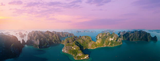Aerial view panorama of Halong bay at sunset with majestic limestone islands in Vietnam