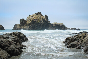 waves crashing on rocks