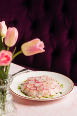a luxurious dinner in a restaurant with seafood in delicate pink tones