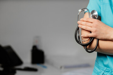 Medicine. Doctor holds his stethoscope to insinuate that it's time for a check up, professional...