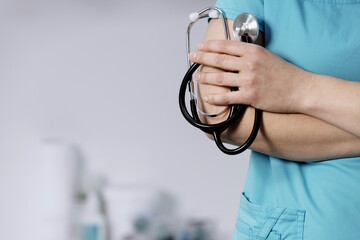 Medicine. Doctor holds his stethoscope to insinuate that it's time for a check up, professional...