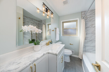 bathroom has been updated with a new vanity new tile and new fixtures installed by a professional
