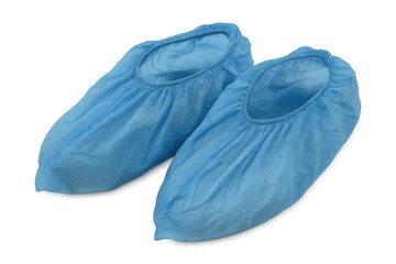 Blue disposable shoe covers protecting feet, ensuring hygiene and safety in medical, industrial settings against white backdrop
