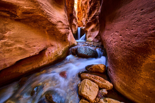 Kanarra Falls Waterfall Motion Through Narrow Slot Canyon Low Perspective