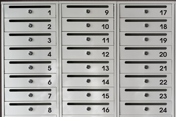 Installation of new mailboxes in the entrance of a multi-storey apartment building. New mailboxes with room numbers