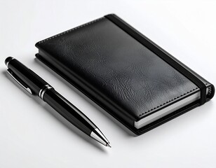 notebook and pen on white table 