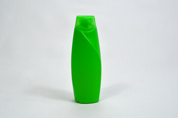 Cosmetic bottle, clean green unbranded shampoo bottle isolated on white background. Plain cosmetic bottle for product advertising

