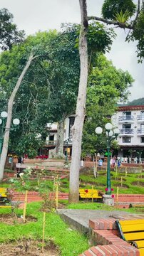 Green park in Jerico main square with colonial surroundings, Antioquia, Colombia