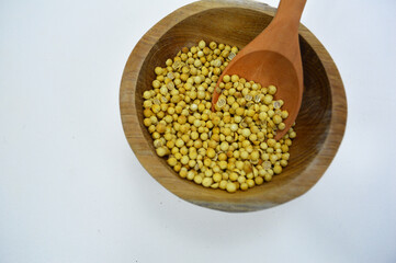 Coriander Seeds in Wood Bowl Isolated, Cilantro Grain, Chinese Parsley Seed Group, Dry Spices, Seasonings, Coriander Herb on White Background 
