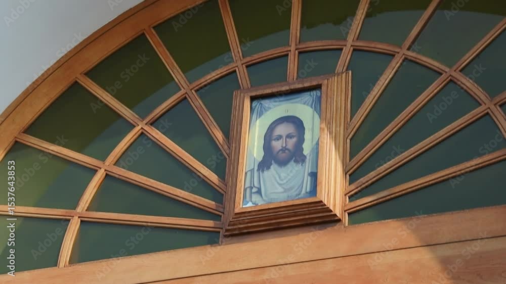 Aufkleber a picture of jesus depicted on a window above a doorway, suitable for use in religious contexts or a