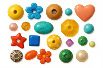 Colorful craft beads, jewels, wooden elements scattered for jewelry making, arranged on transparent surface ready for creative projects
