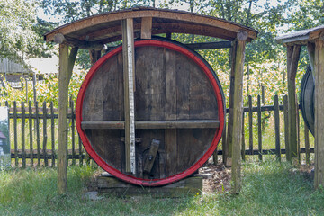 Old barrel with alcoholic beverage in the countryside