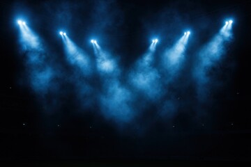 Epic Stadium Arena with Dramatic Blue Spotlights and Atmospheric Smoke Effects During Night Event