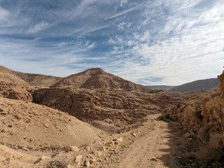 Jordan Trail long distance hiking from Dana Valley to Petra and Wadi Rum.Wadi Rum Desert, Jordan. The red desert and Jabal Al Qattar mountains,Arabia