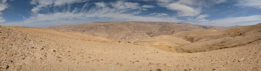 Jordan Trail long distance hiking from Dana Valley to Petra and Wadi Rum.Wadi Rum Desert, Jordan. The red desert and Jabal Al Qattar mountains,Arabia