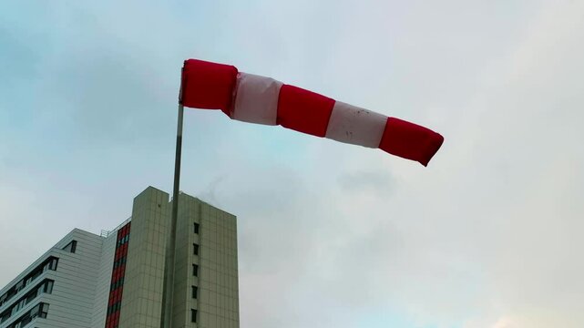 Flying Windsock in front of a Building Complex