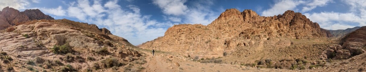Jordan Trail long distance hiking from Dana Valley to Petra and Wadi Rum.Wadi Rum Desert, Jordan. The red desert and Jabal Al Qattar mountains,Arabia