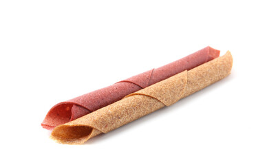 Delicious fruit leather rolls on white background