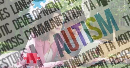 Reading couple in casual outfits leaning over open book in park, with autism overlay graphics