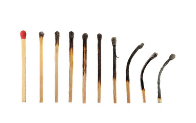 Burnt matches and whole one on white background