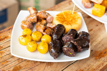 Typical Boyaca roasted - Beef, chorizo, arepas, sausage, plantains, and potatoes