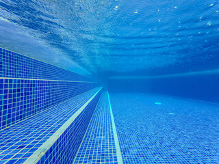 Underwater view of the pool mosaic tile and water jets