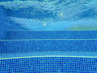 Underwater view of the pool mosaic tile and water jets